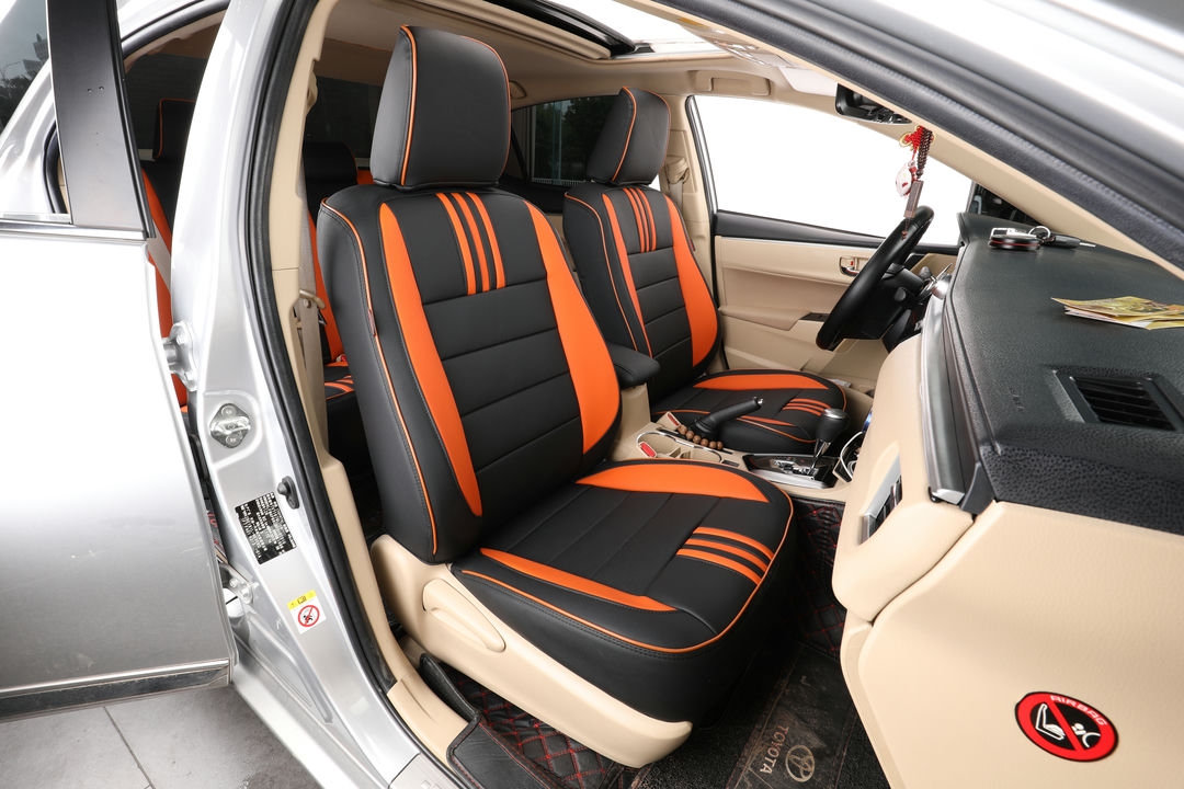 toyota corolla ekr custom seat covers ad black leather with orange stripes and edge stitching 1